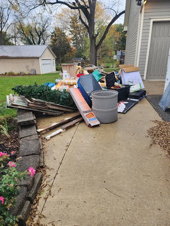 Dumpster being loaded with debris for Commercial Dumpster Rental in Willington